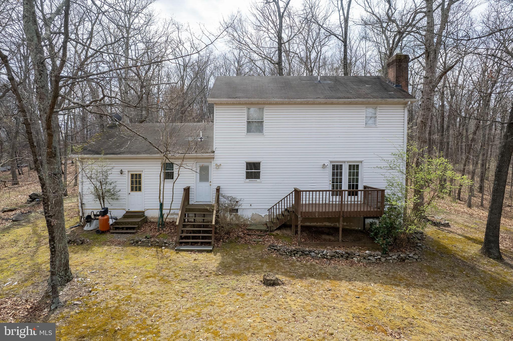 430 Babbs Mountain Road Winchester, VA 22603 - Photo 3 of 49 a view of a patio with a table and chairs next to a yard