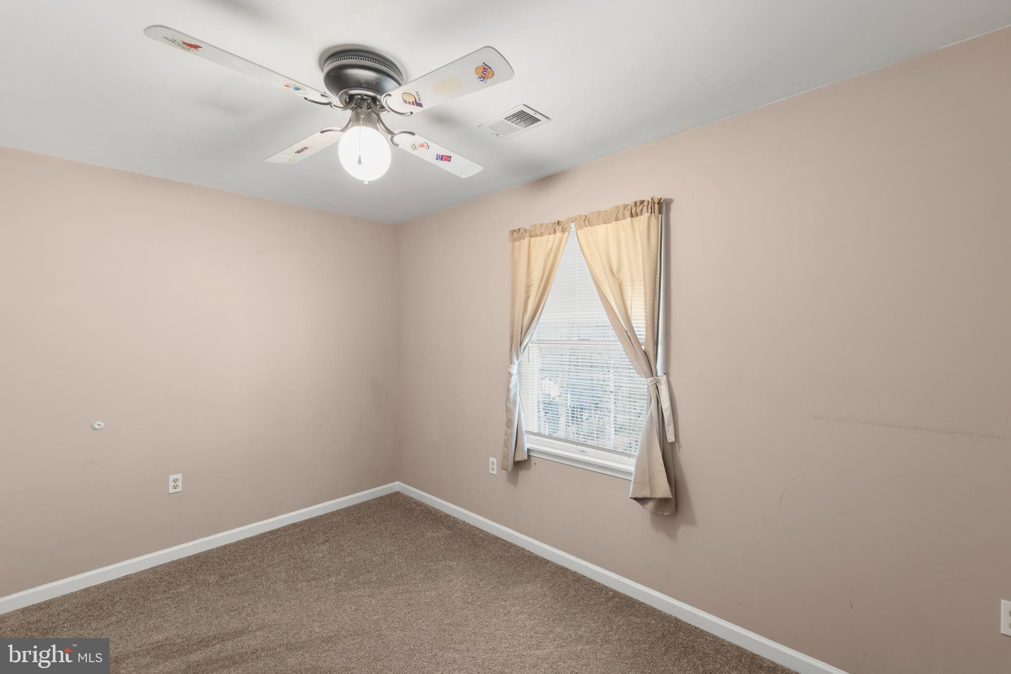 430 Babbs Mountain Road Winchester, VA 22603 - Photo 32 of 49 an empty room with windows and fan