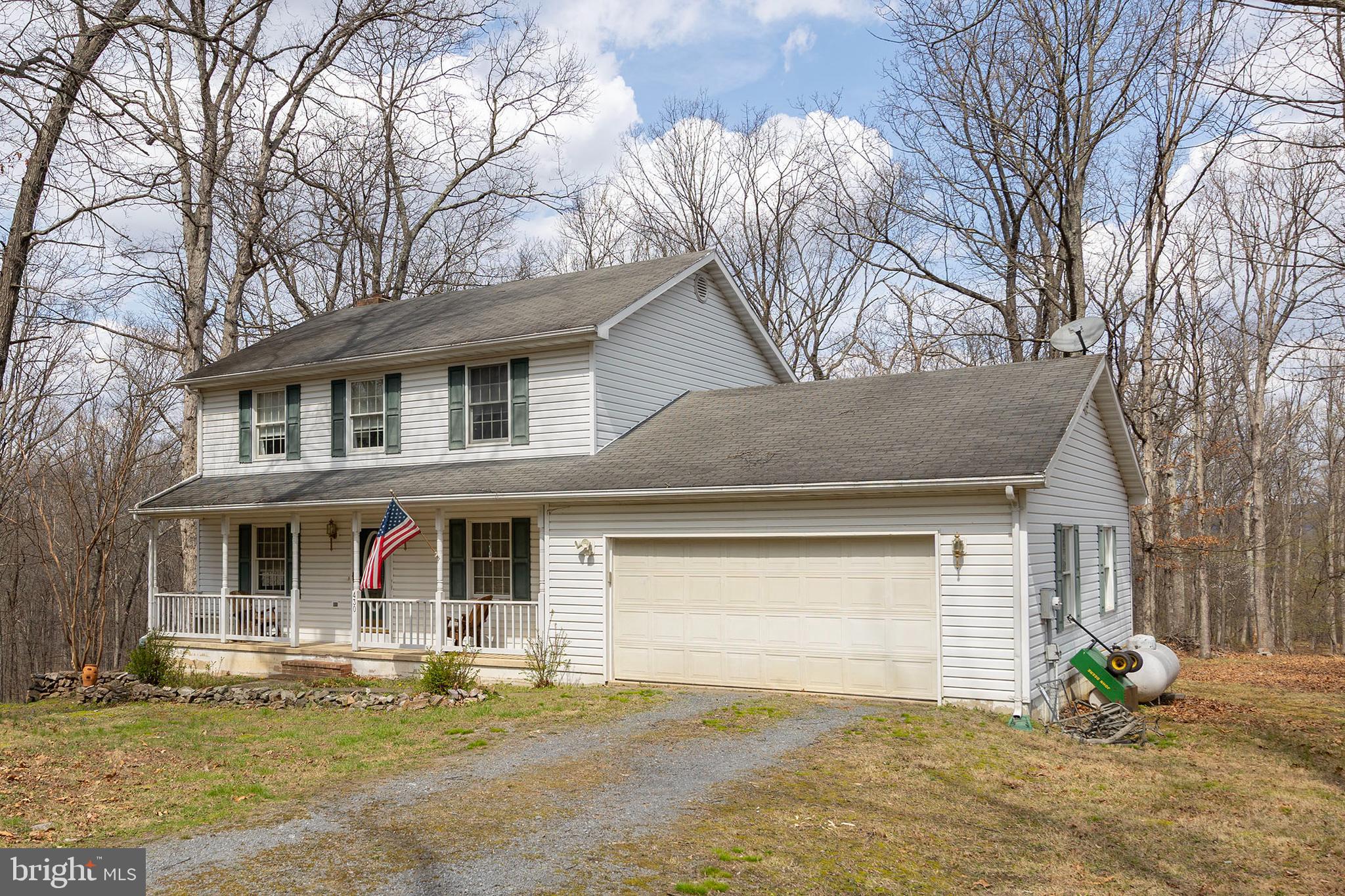 430 Babbs Mountain Road Winchester, VA 22603 - Photo 44 of 49 a front view of a house with a garden and plants