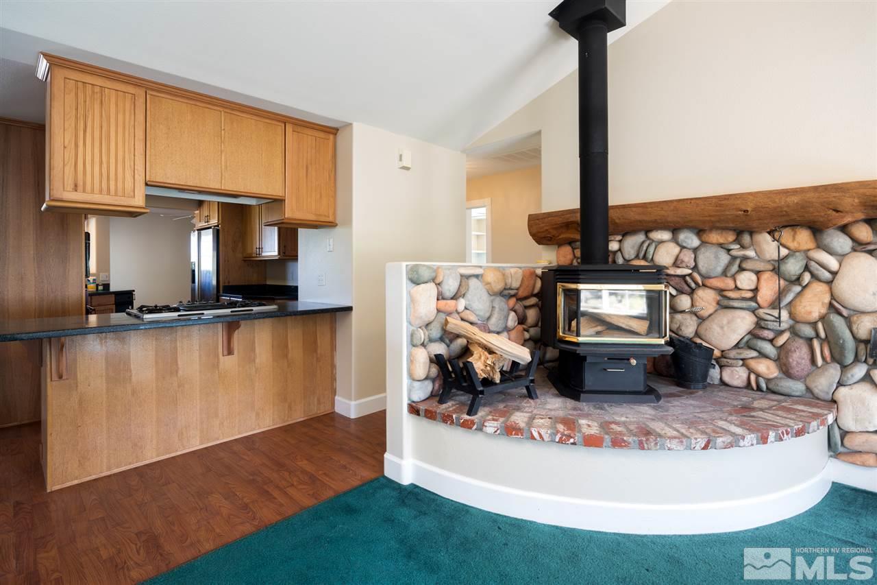 21859 Adobe Road Reno, NV 89521 - Photo 11 of 40 a living room with furniture and a wooden floor