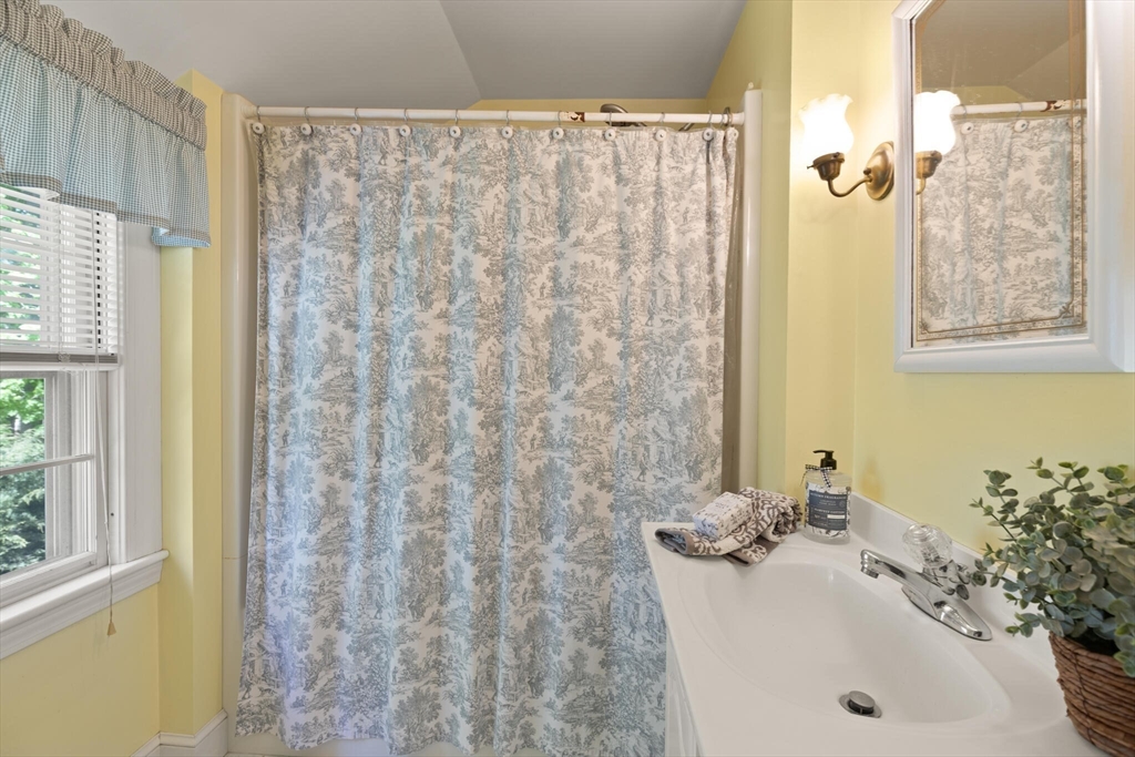 51 Pine Ridge Road Reading, MA 01867 - Photo 26 of 30 a bathroom with a sink and a mirror