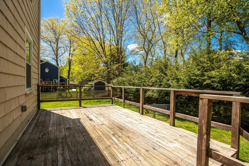 51 Pine Ridge Road Reading, MA 01867 - Photo 29 of 30 a view of swimming pool with wooden floor and fence
