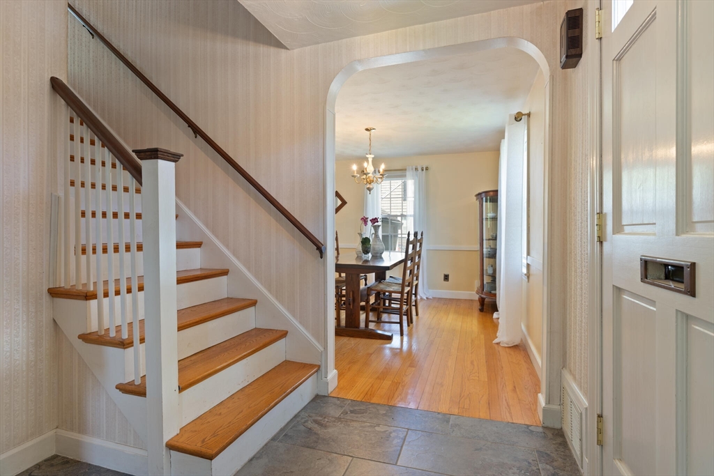51 Pine Ridge Road Reading, MA 01867 - Photo 5 of 30 a view of entryway and hall with wooden floor