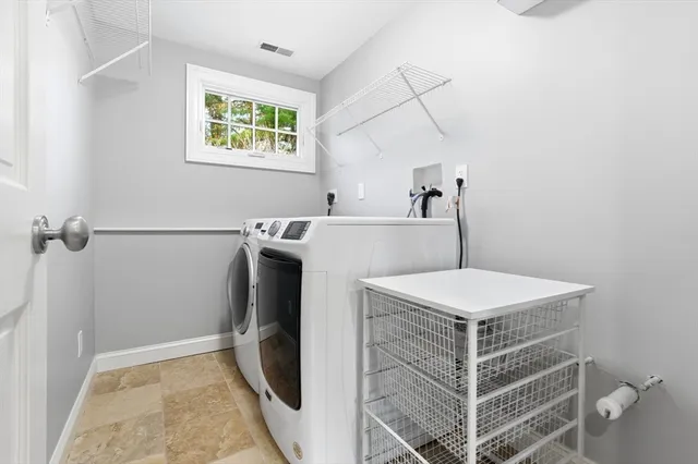 a utility room with dryer and washer