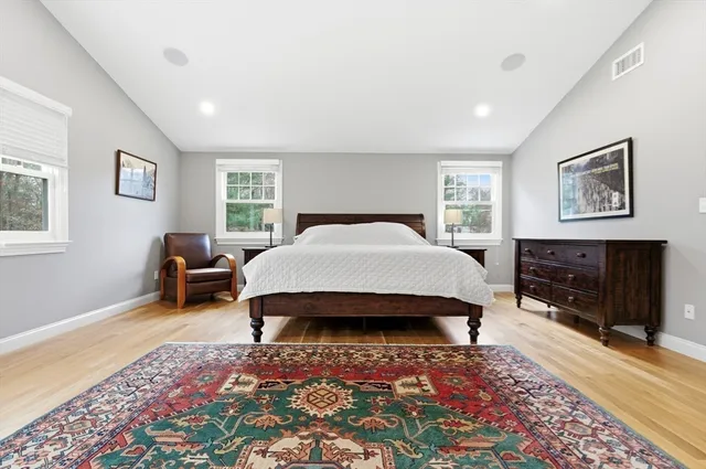 a bedroom with a bed and a couch