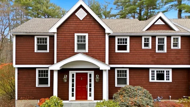 a front view of a house with garden
