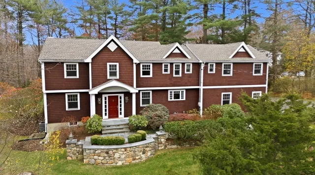 front view of a house with a yard