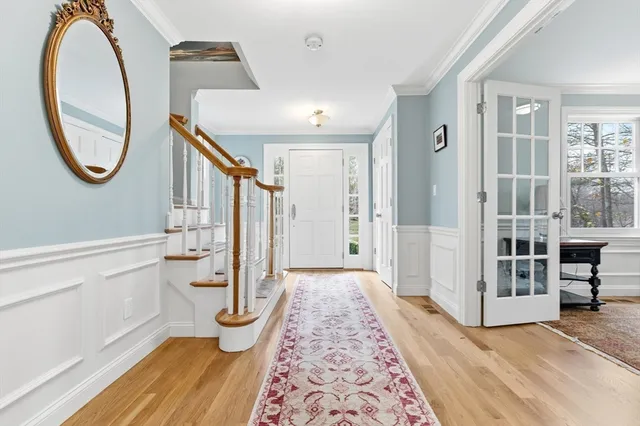 a bathroom with a toilet and a mirror