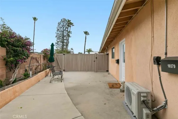 a view of house with outdoor seating space