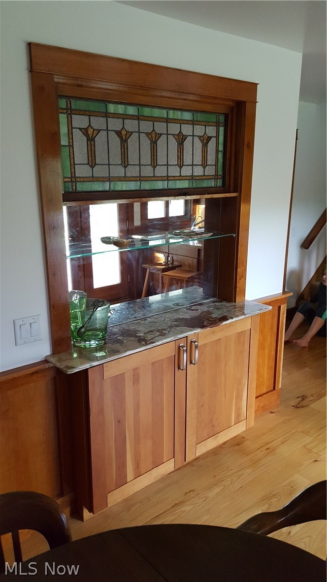 31350 Pinetree Road Cleveland, OH 44124 - Photo 8 of 33 The built in wine cabinet with an onyx counter is centrally located
