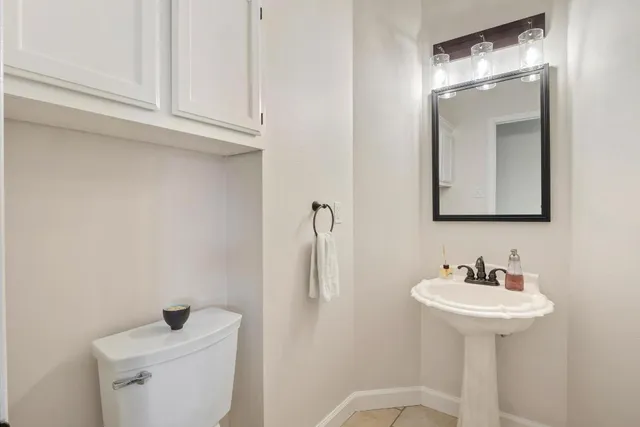 a bathroom with a sink and mirror
