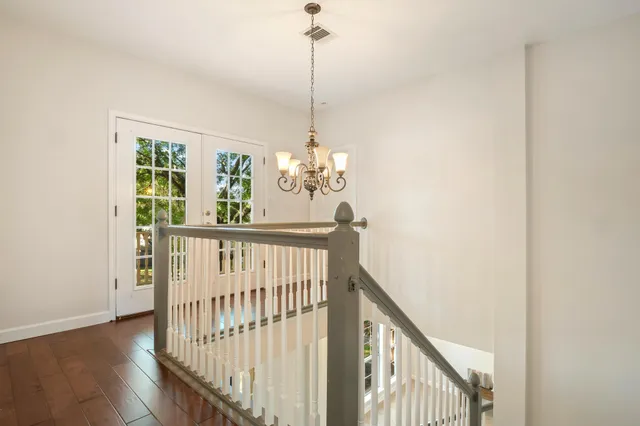 a view of a hallway with windows