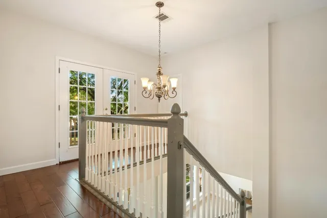 a view of a hallway with windows
