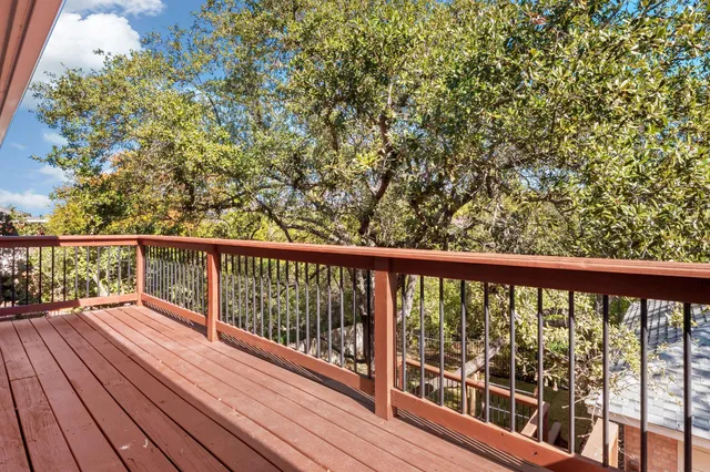 a view of balcony with wooden floor