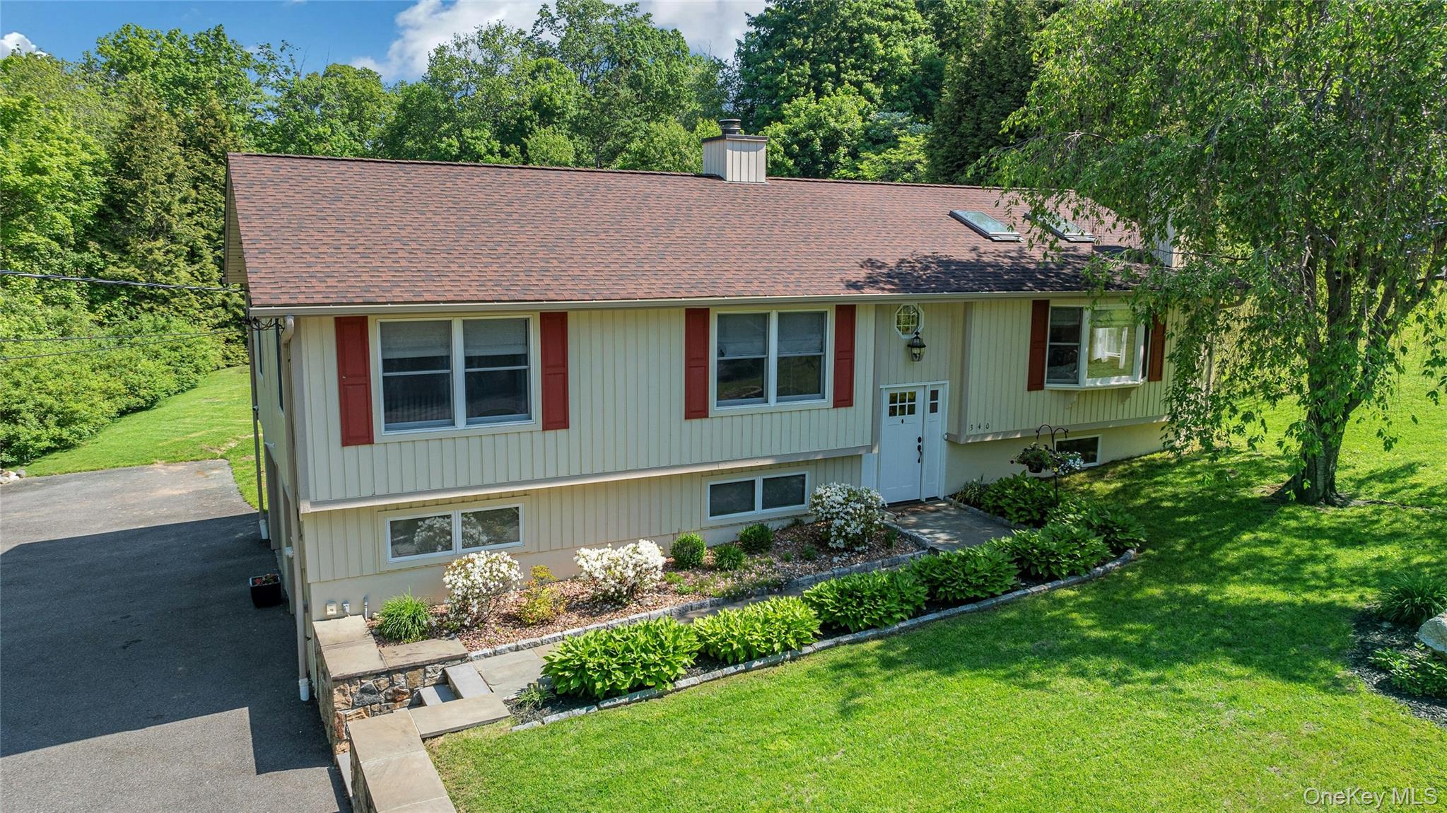 340 Osceola Road Jefferson Valley, NY 10535 - Photo 37 of 48 a aerial view of a house with table and chairs