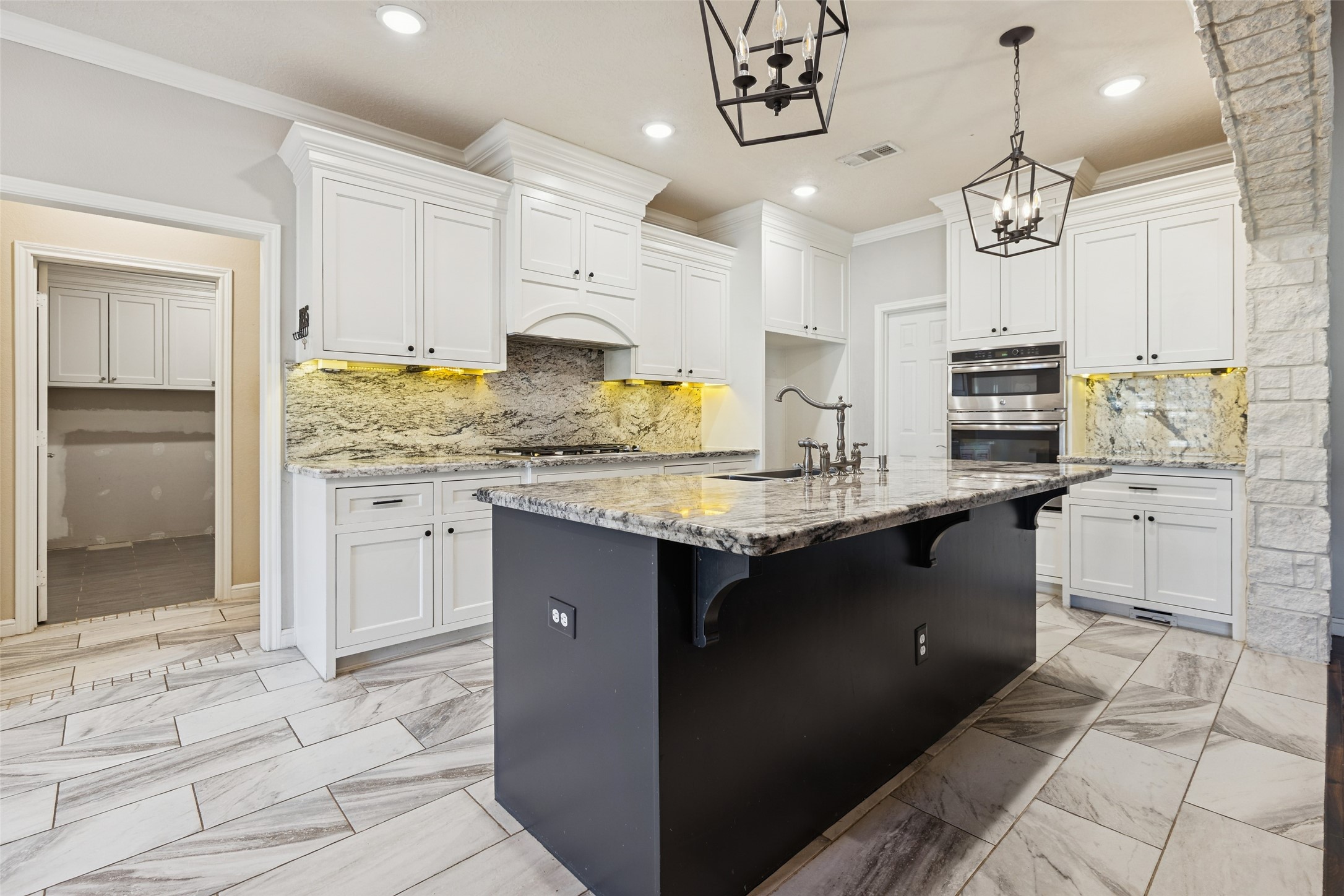 21724 Stargrass Drive Spring, TX 77388 - Photo 14 of 50 a kitchen with kitchen island granite countertop a sink counter and cabinets