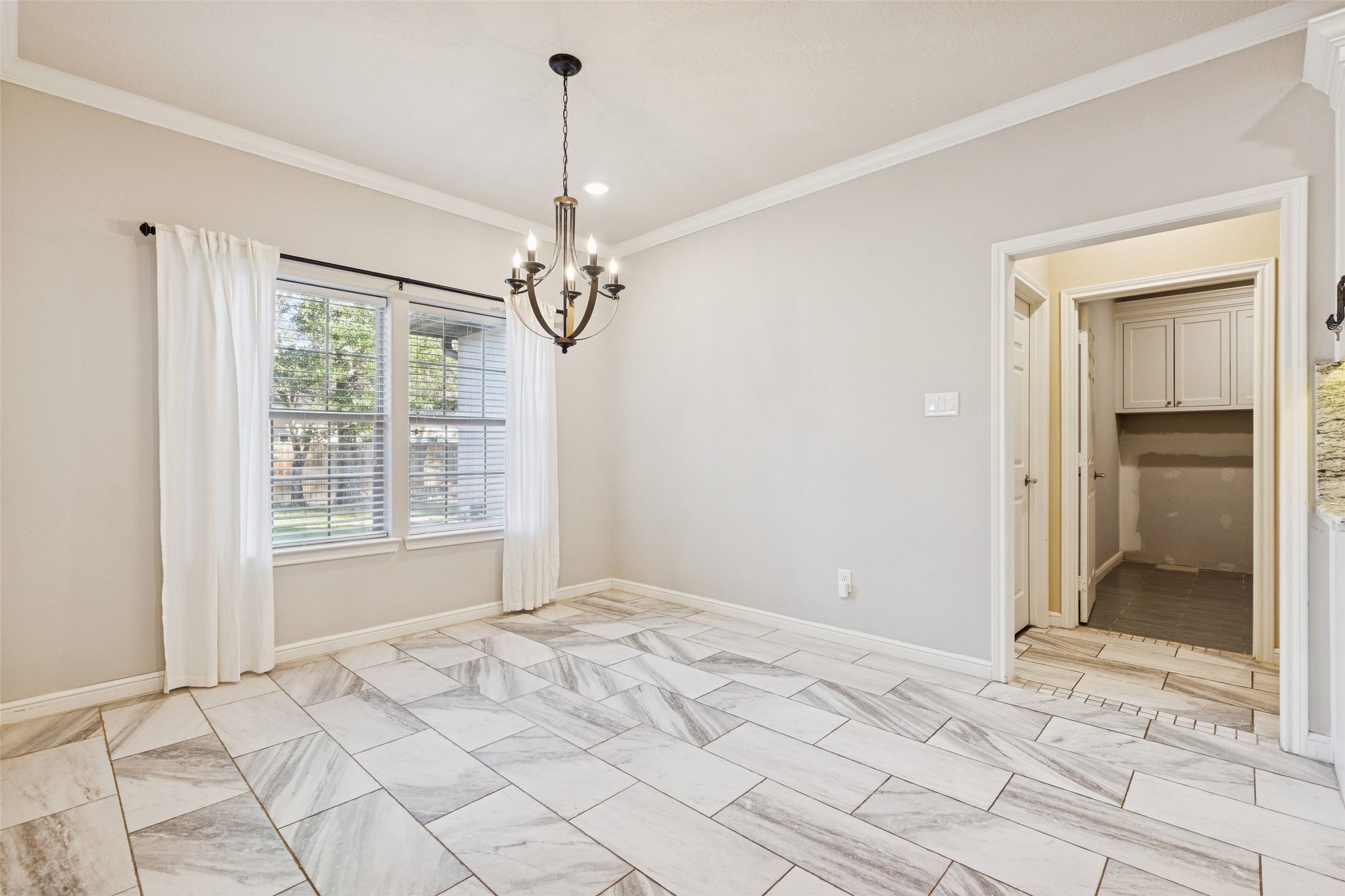 21724 Stargrass Drive Spring, TX 77388 - Photo 17 of 50 a view of an empty room with window and chandelier fan