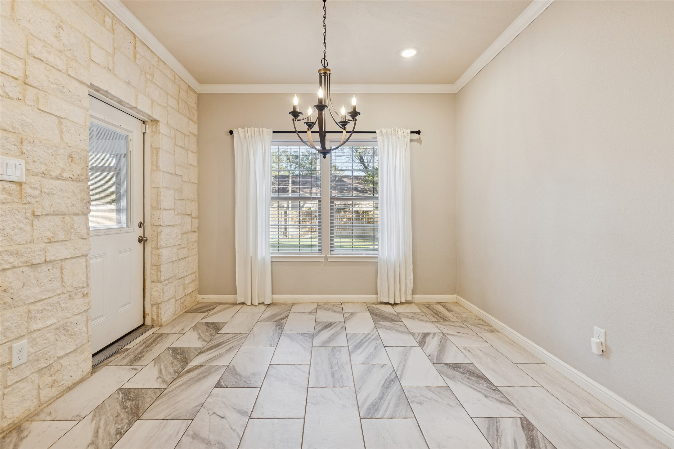 21724 Stargrass Drive Spring, TX 77388 - Photo 18 of 50 a view of a room with a chandelier