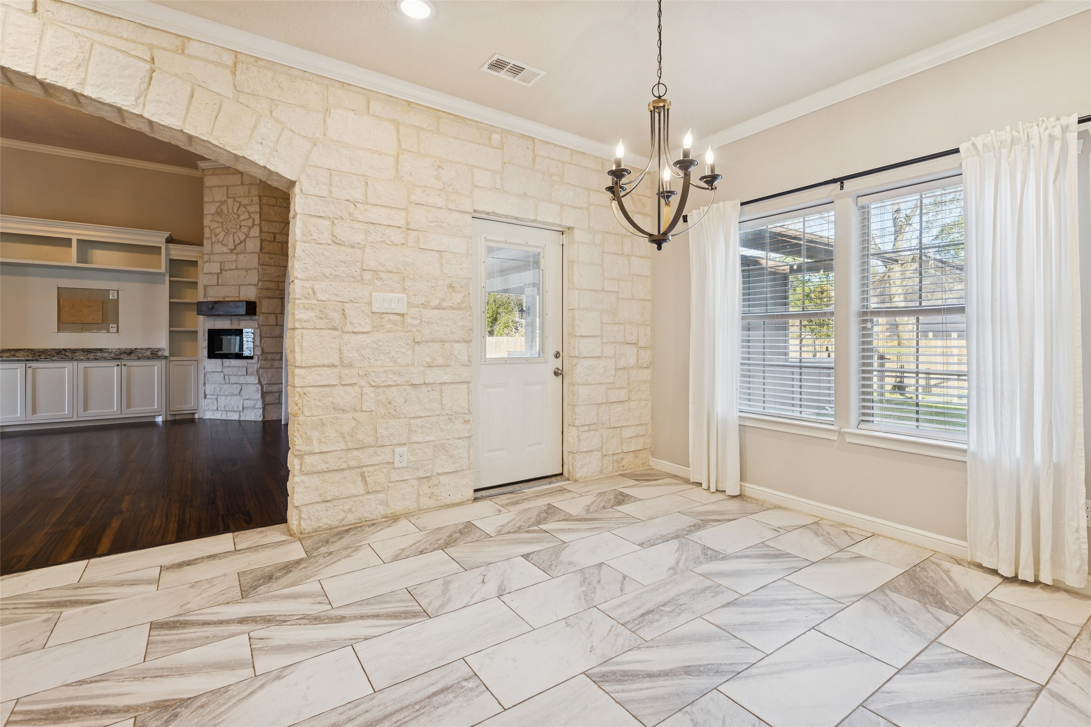 21724 Stargrass Drive Spring, TX 77388 - Photo 19 of 50 a view of a livingroom with a chandelier fan and windows