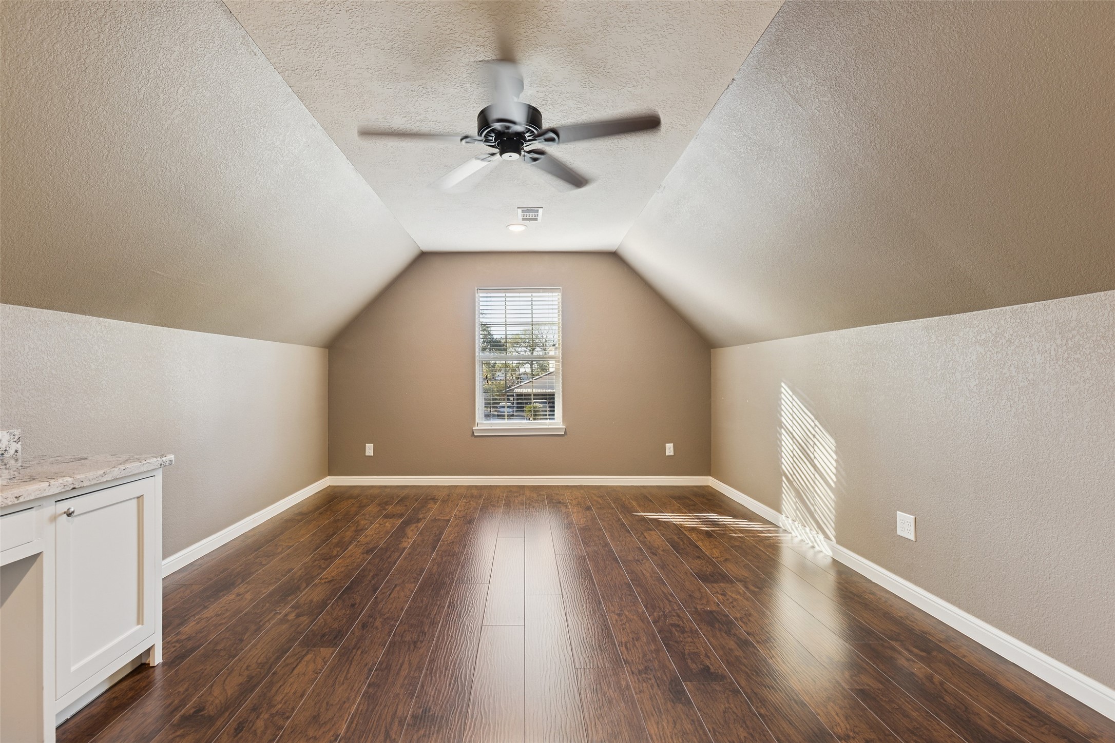 21724 Stargrass Drive Spring, TX 77388 - Photo 37 of 50 an empty room with wooden floor fan and windows