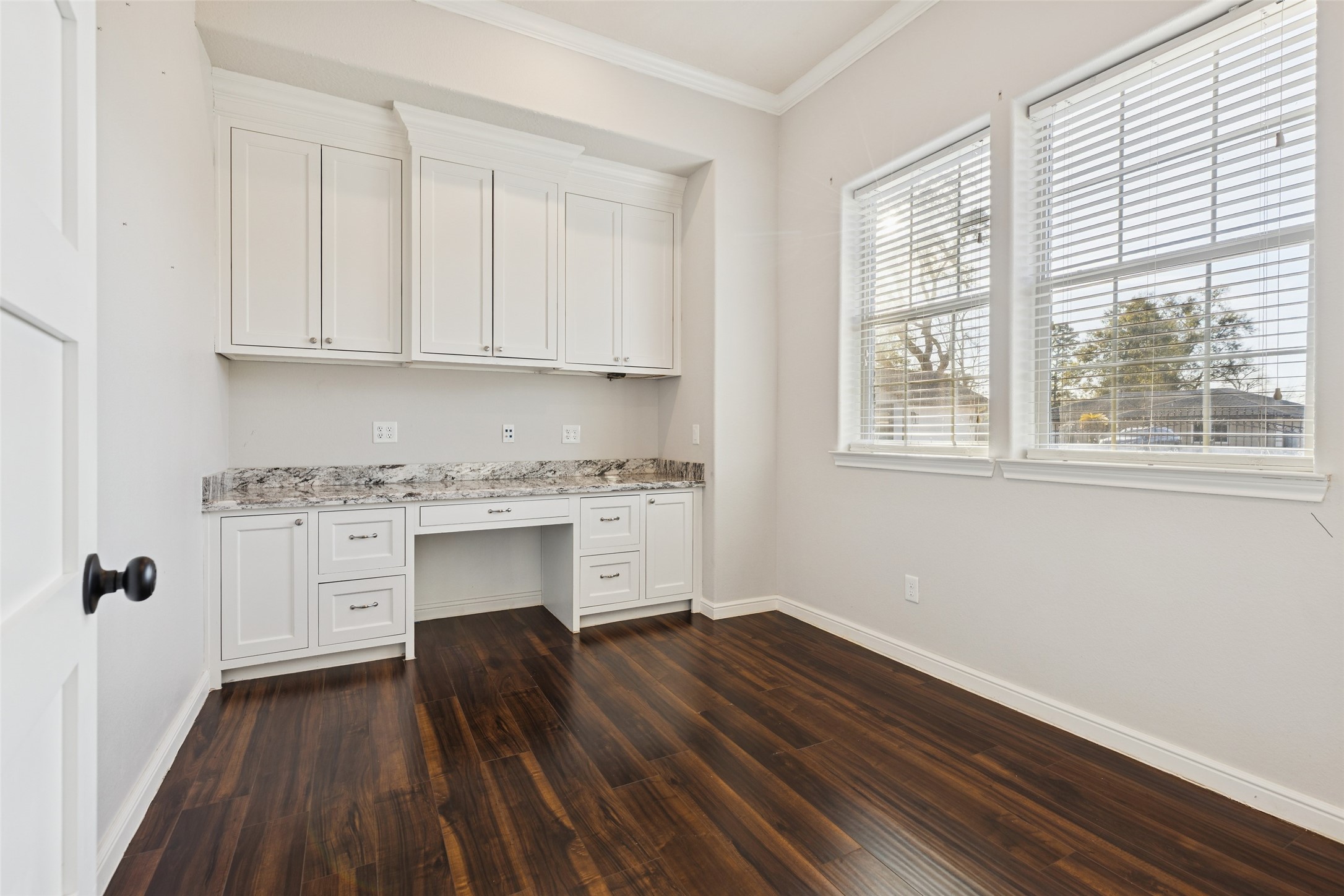 21724 Stargrass Drive Spring, TX 77388 - Photo 5 of 50 a kitchen with granite countertop white cabinets and white appliances with wooden floor