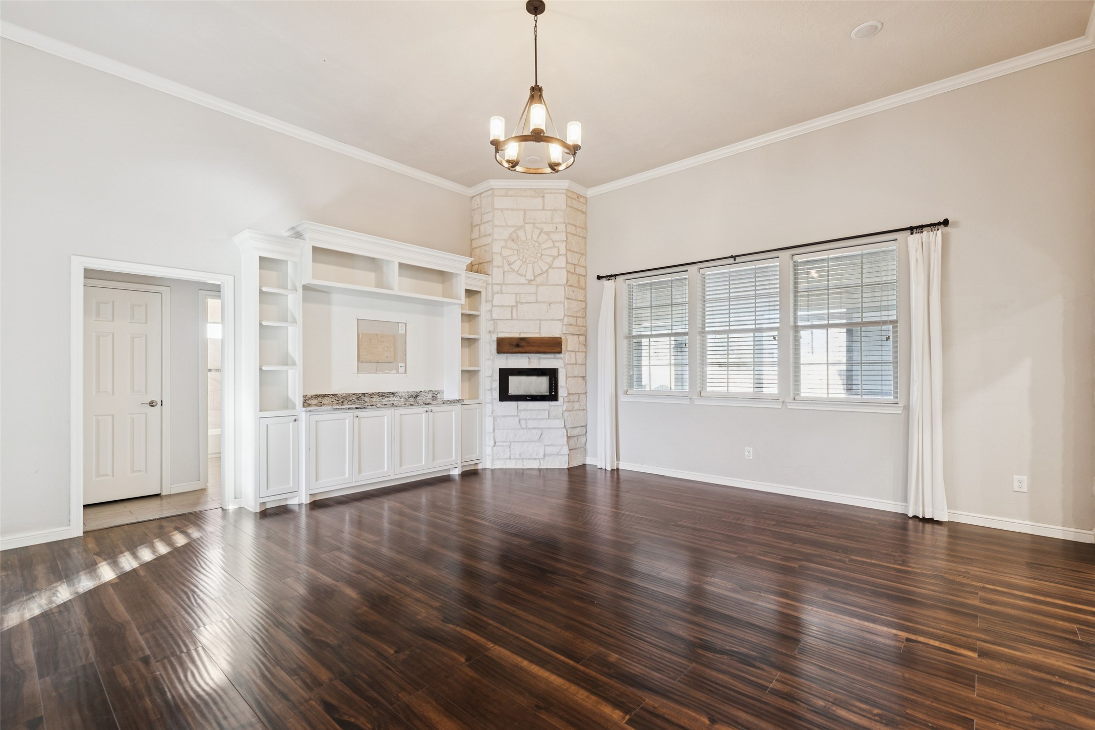 21724 Stargrass Drive Spring, TX 77388 - Photo 6 of 50 a view of an empty room with wooden floor and a window
