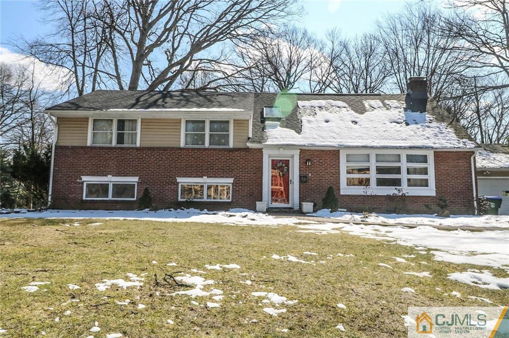 16 Clive Hills Road Edison, NJ 08820 - Photo 1 of 25 a front view of a house with a yard
