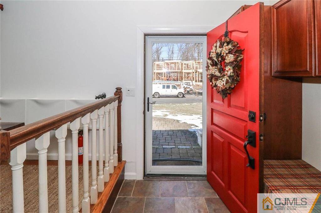 16 Clive Hills Road Edison, NJ 08820 - Photo 2 of 25 a view of entryway with wooden floor and door
