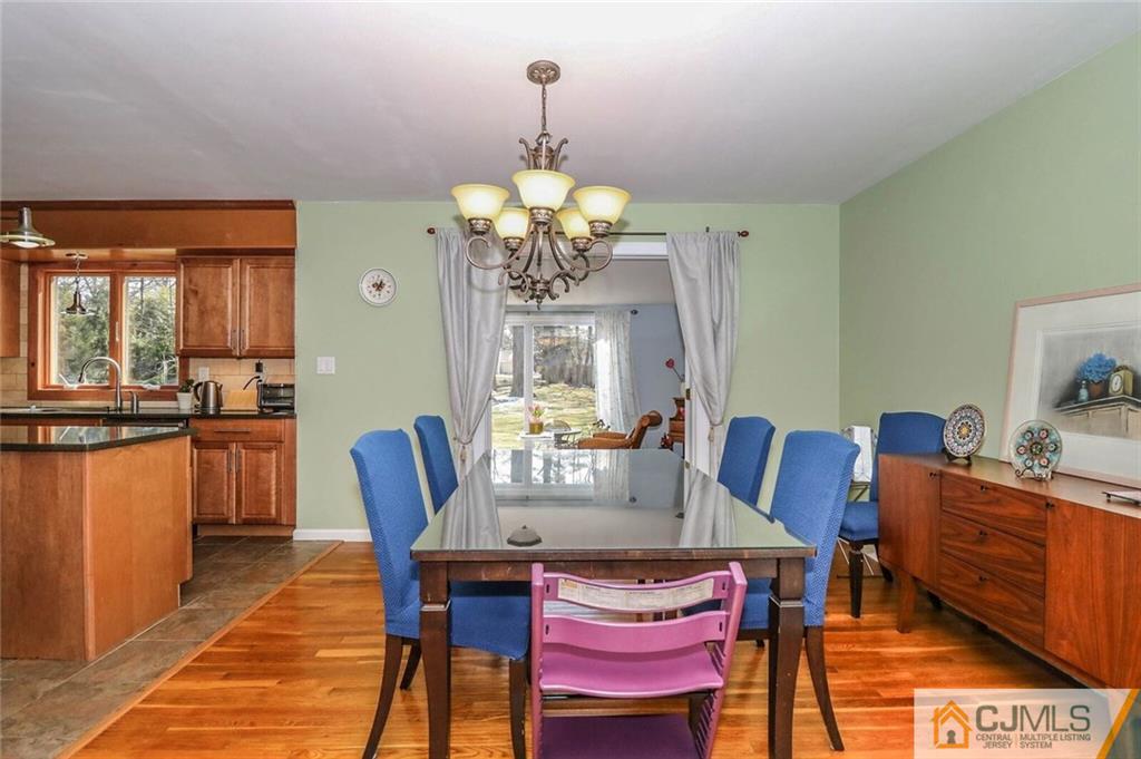 16 Clive Hills Road Edison, NJ 08820 - Photo 11 of 25 a view of a dining room with furniture and chandelier