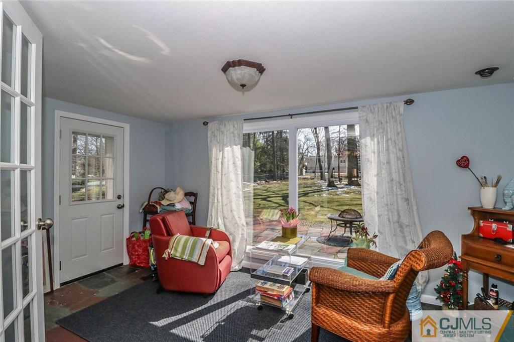 16 Clive Hills Road Edison, NJ 08820 - Photo 12 of 25 a living room with furniture and a large window
