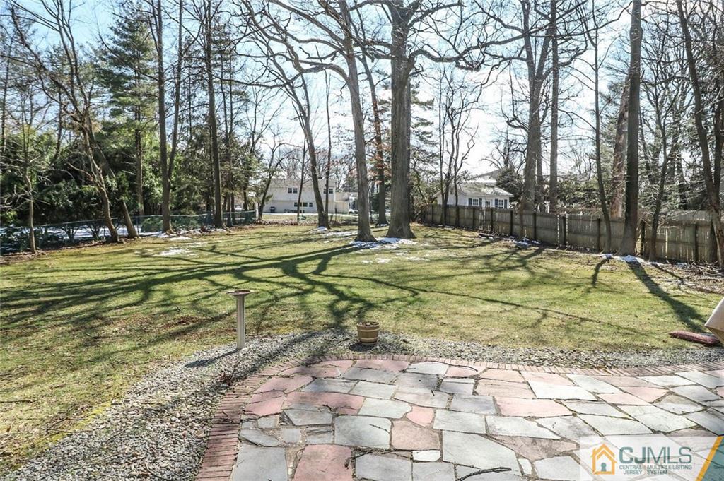 16 Clive Hills Road Edison, NJ 08820 - Photo 22 of 25 a swimming pool with trees in the background