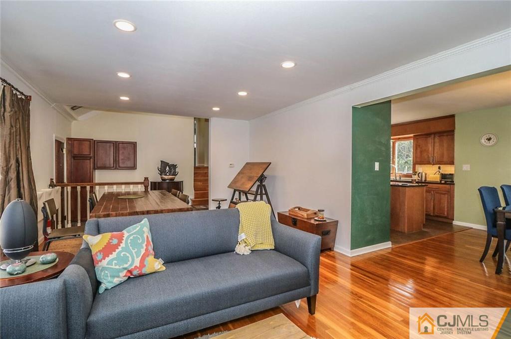 16 Clive Hills Road Edison, NJ 08820 - Photo 5 of 25 a living room with furniture and a flat screen tv