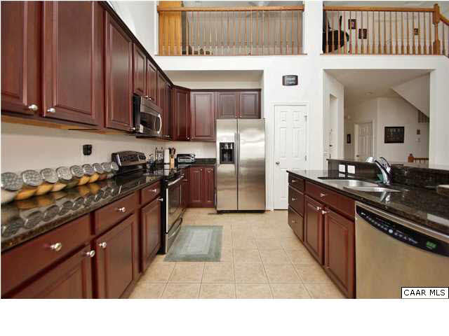 of the 12x10 gourmet kitchen with cherry cabinets and granite counters.