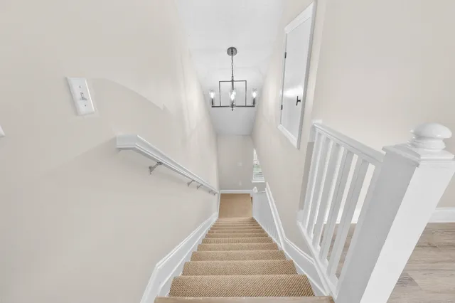 a view of a hallway with staircase