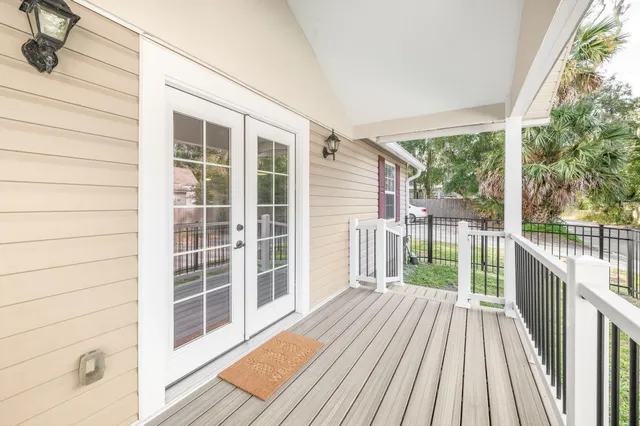 a view of a balcony with wooden floor