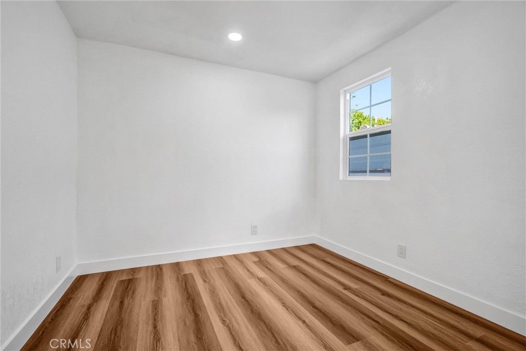 1200 South Castlegate Avenue Compton, CA 90221 - Photo 15 of 39 a view of an empty room and window