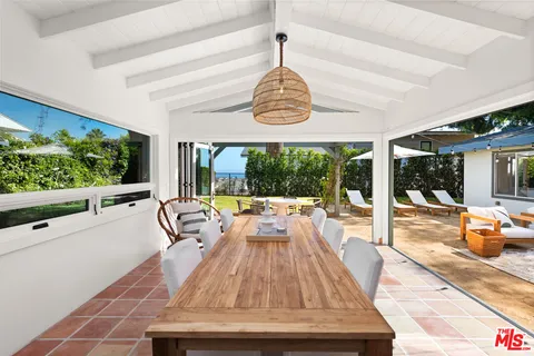 a view of swimming pool with seating area