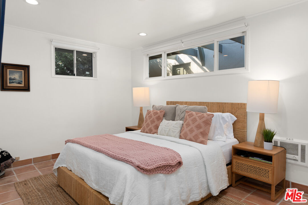 31562 Broad Beach Road Malibu, CA 90265 - Photo 19 of 31 a bedroom with bed and window