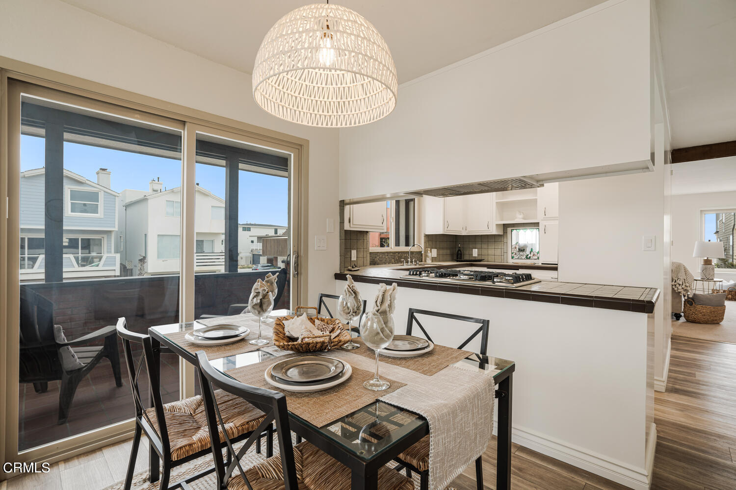 3700 Ocean Drive Oxnard, CA 93035 - Photo 15 of 55 a view of a dining room with furniture window and wooden floor