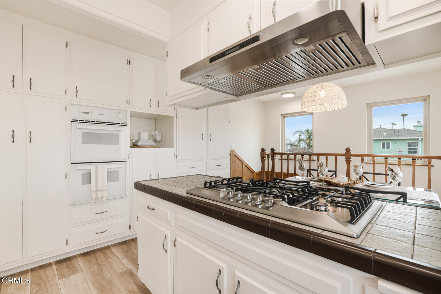 3700 Ocean Drive Oxnard, CA 93035 - Photo 21 of 55 a kitchen with white cabinets and appliances
