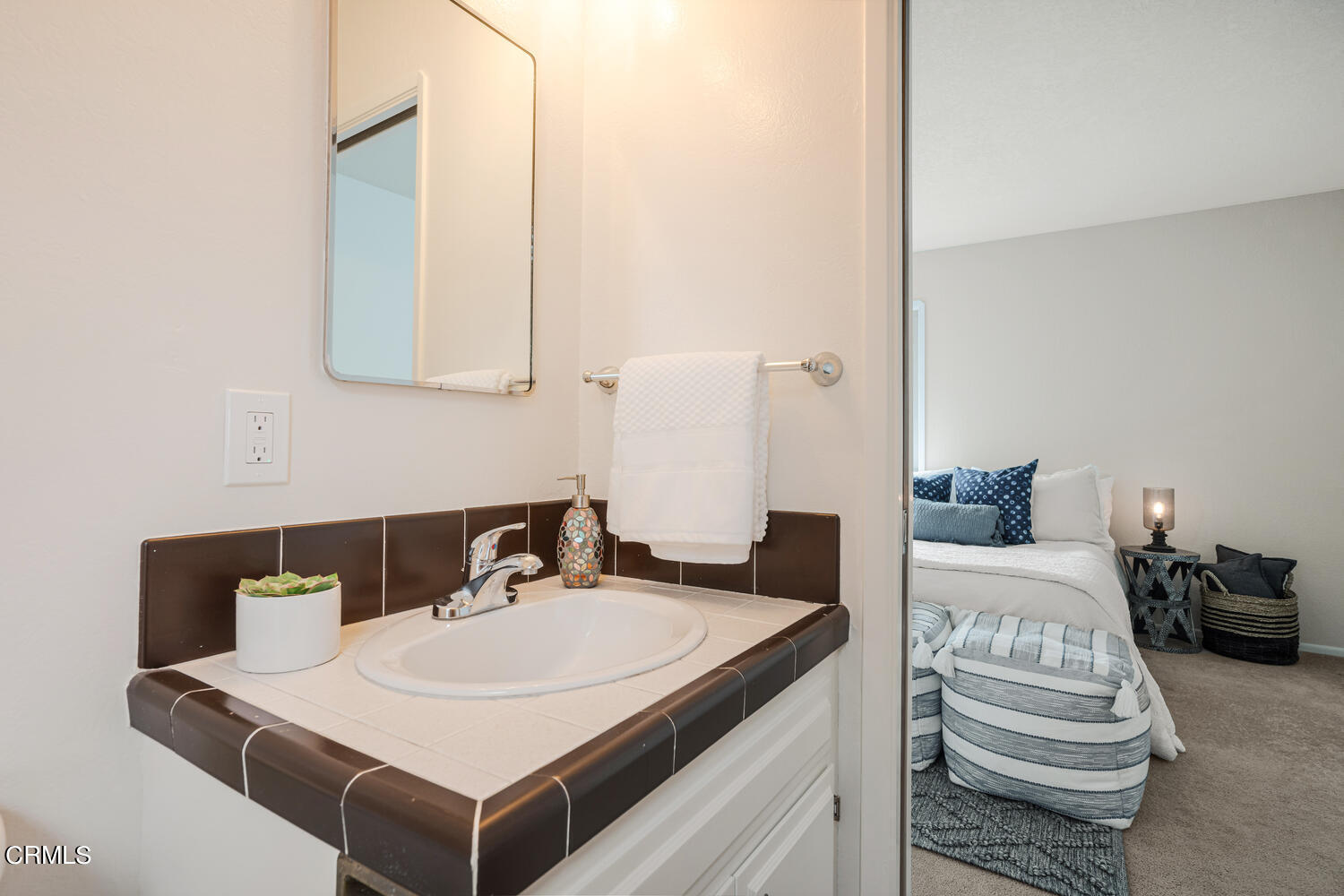 3700 Ocean Drive Oxnard, CA 93035 - Photo 23 of 55 a bathroom with a sink and a mirror