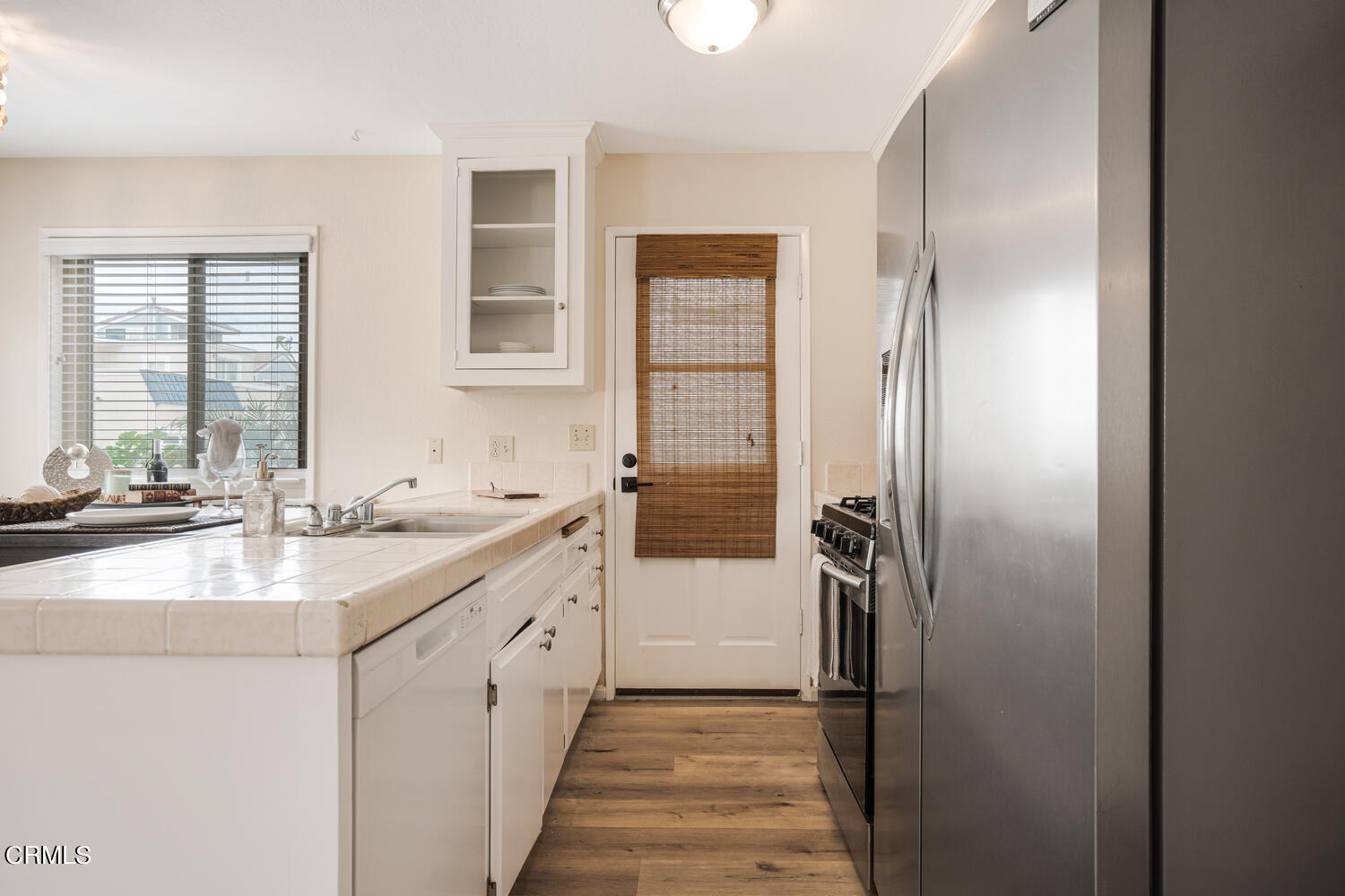 3700 Ocean Drive Oxnard, CA 93035 - Photo 39 of 55 a kitchen with a sink and refrigerator