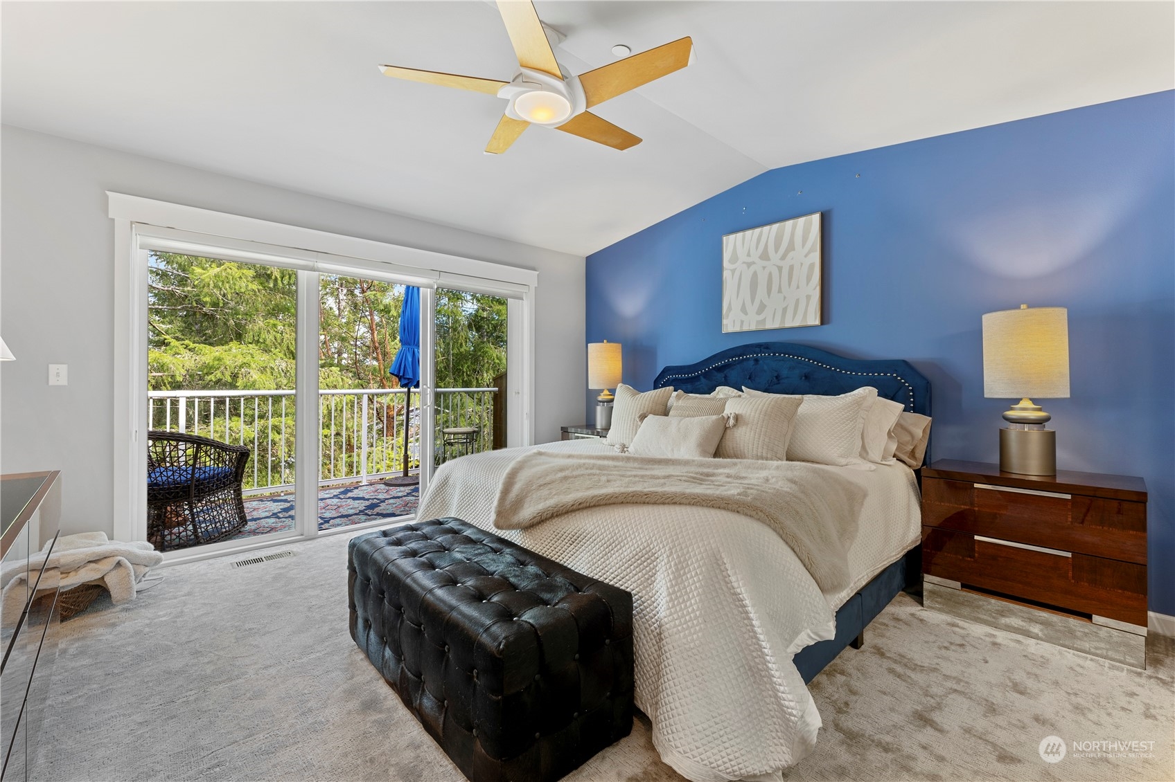 160 East Soderberg Road, Unit J28 Allyn, WA 98524 - Photo 15 of 39 a spacious bedroom with a bed and a chandelier