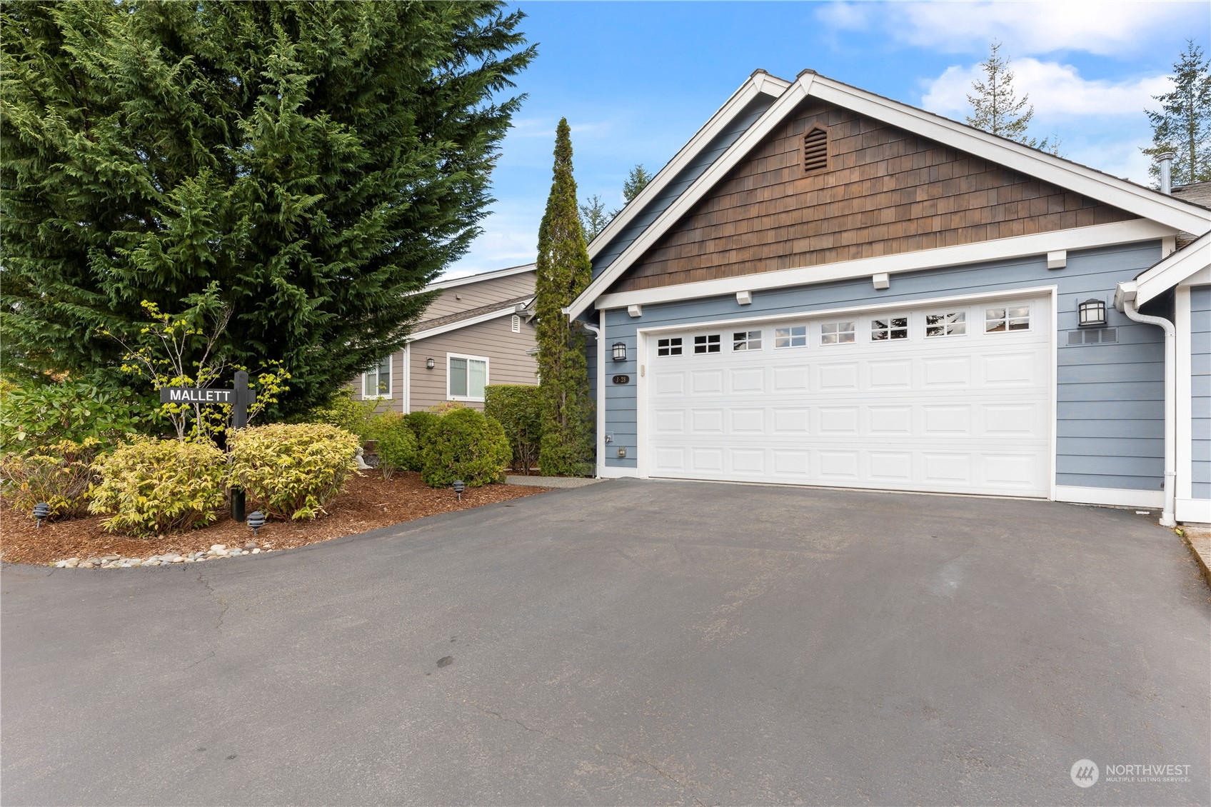 160 East Soderberg Road, Unit J28 Allyn, WA 98524 - Photo 36 of 39 a view of garage and yard