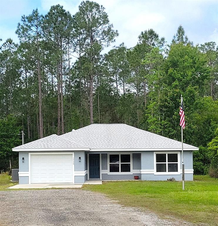1730 Berrybush Street Bunnell, FL 32110 - Photo 1 of 43 a house that has a tree in it