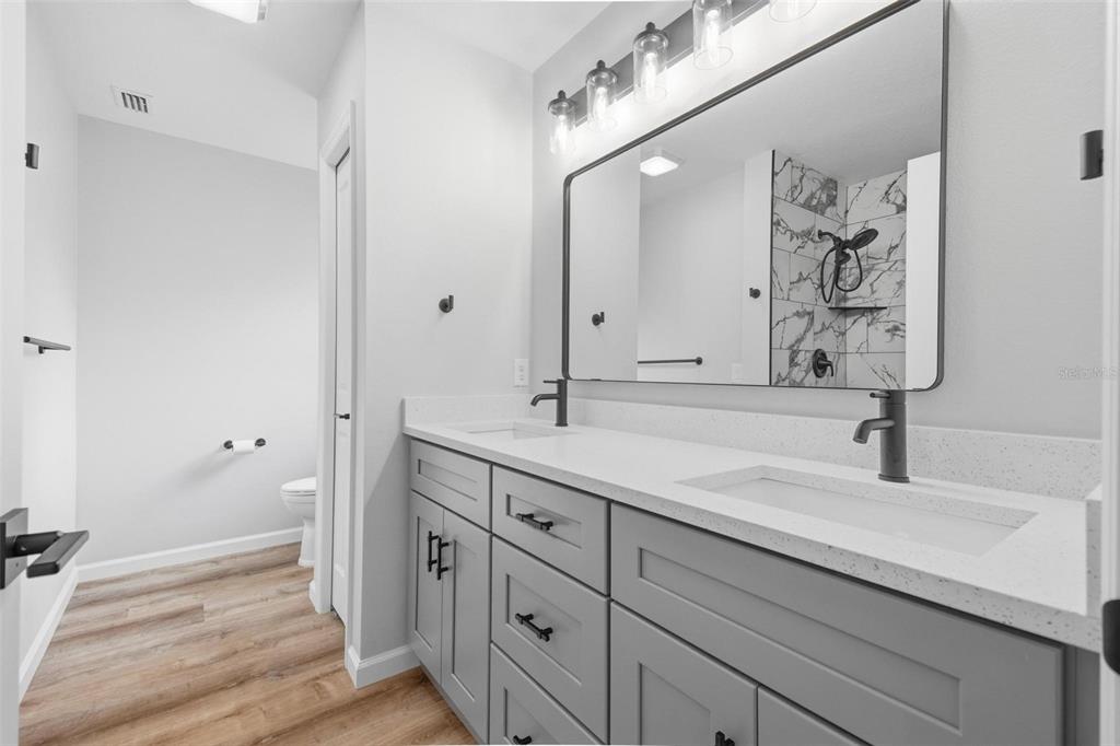 1730 Berrybush Street Bunnell, FL 32110 - Photo 20 of 43 a bathroom with a sink and a mirror