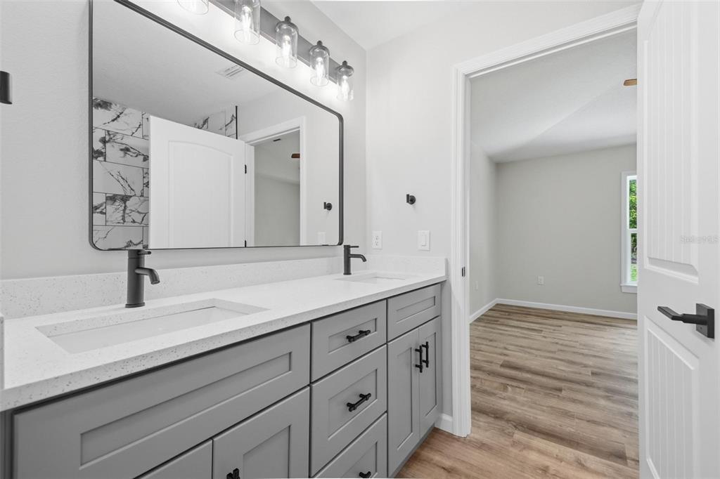 1730 Berrybush Street Bunnell, FL 32110 - Photo 21 of 43 a bathroom with a sink and a mirror