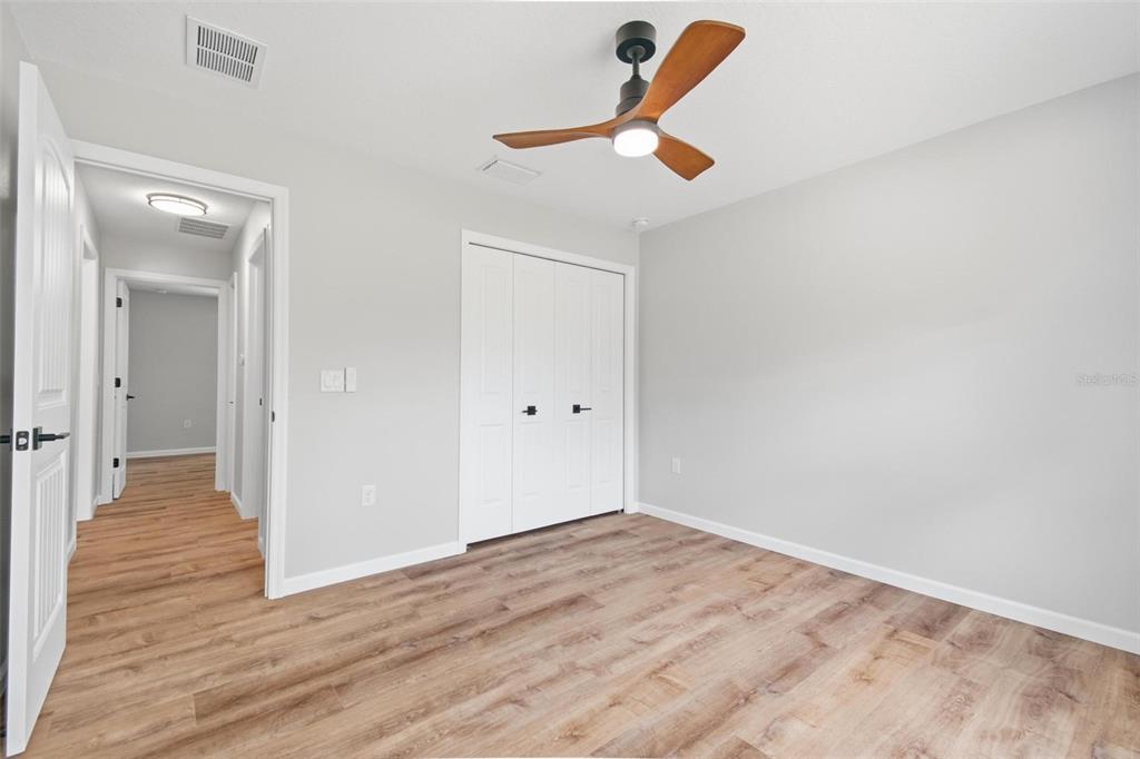 1730 Berrybush Street Bunnell, FL 32110 - Photo 26 of 43 a view of a livingroom with wooden floor