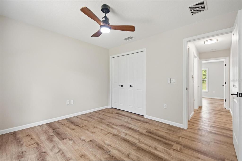 1730 Berrybush Street Bunnell, FL 32110 - Photo 28 of 43 wooden floor in an empty room