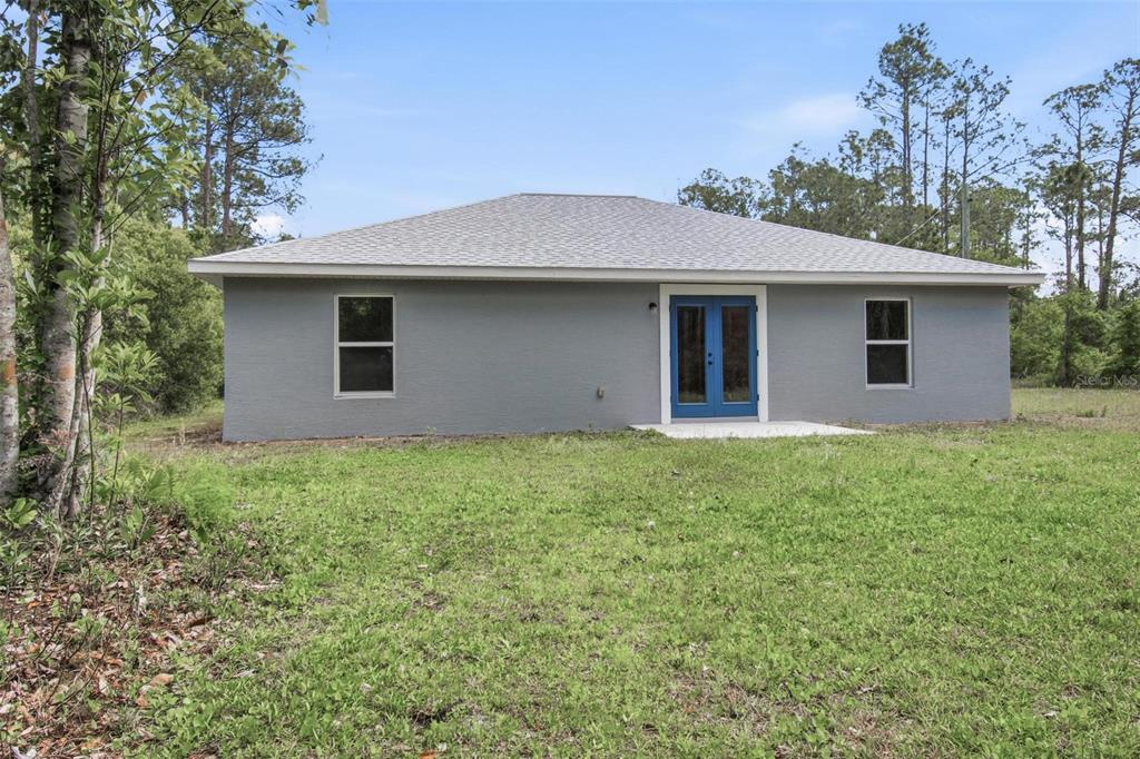 1730 Berrybush Street Bunnell, FL 32110 - Photo 37 of 43 a backyard of a house with lots of green space